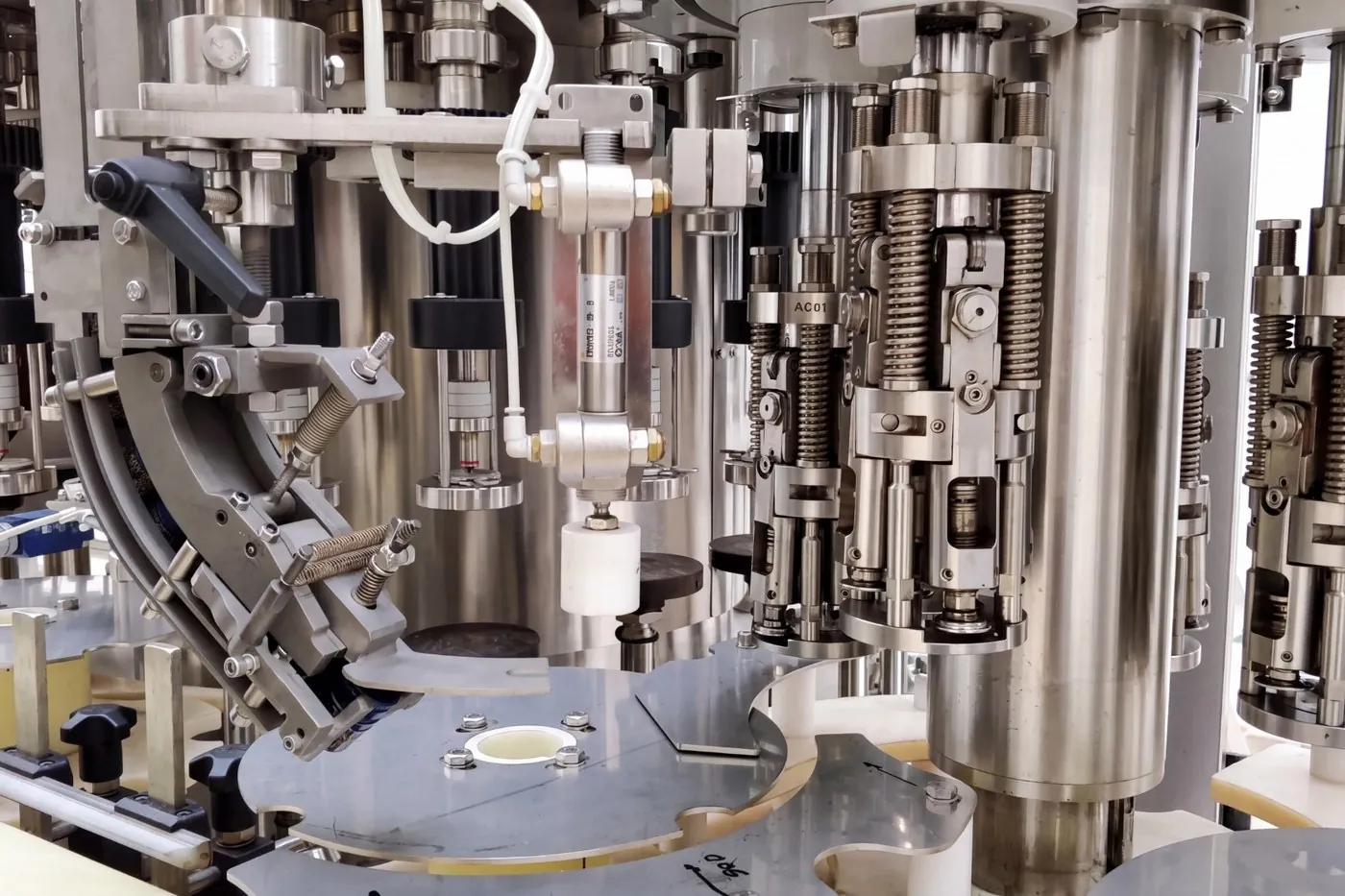 Filling line: capping and dosing units close up